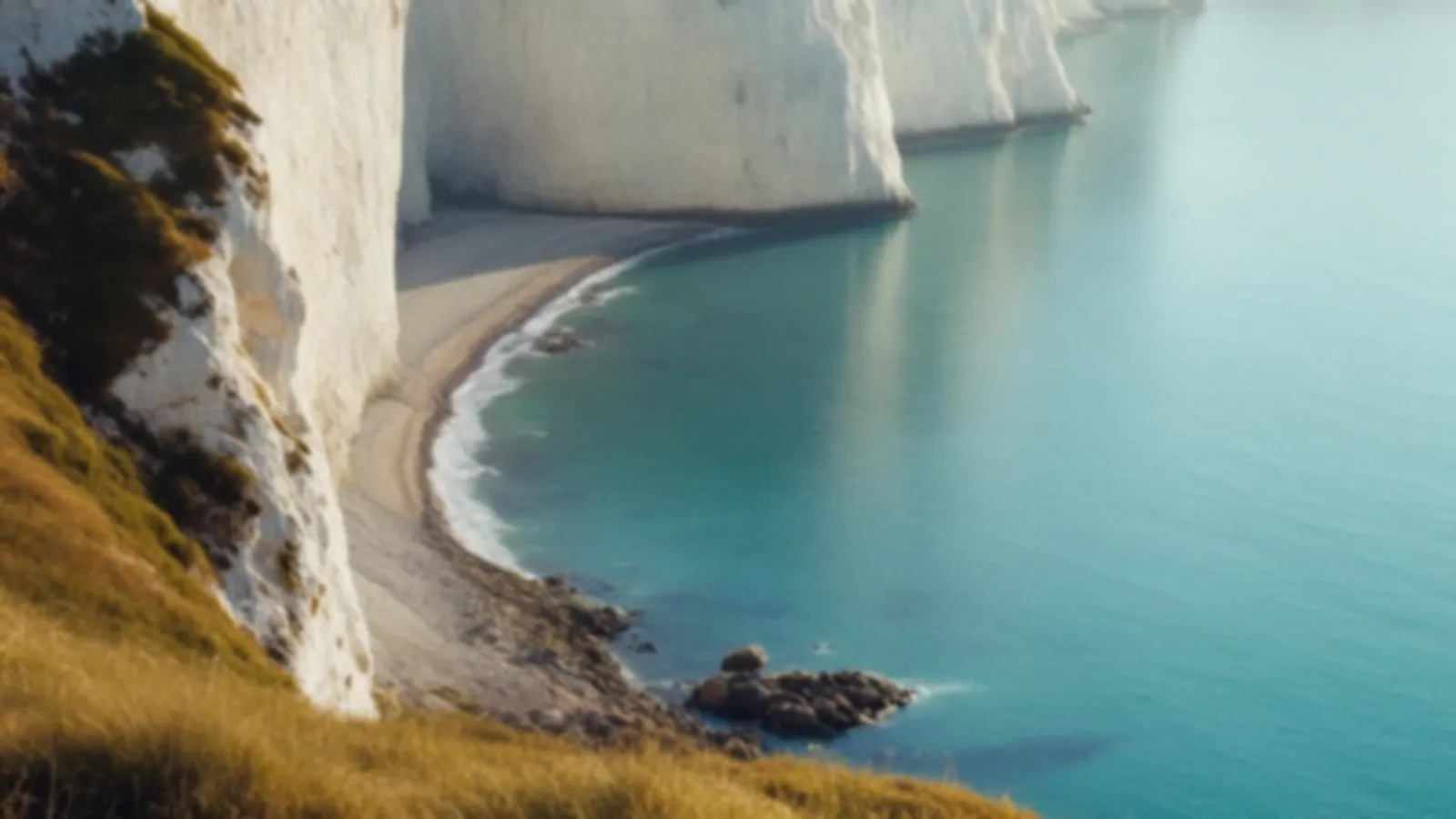 Soft morning light over pale chalk cliffs and a calm turquoise sea, the IvoryLumo view of online loans with clear terms, $100 – $5,000